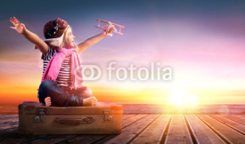 Fototapety Dream journey - Little Girl On Vintage Suitcase At Sunset 
