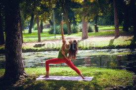 Naklejki young woman practice yoga outdoor