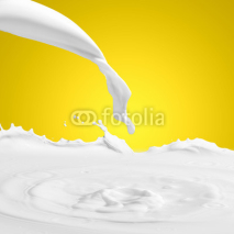 Naklejki Pouring milk splash