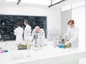 Naklejki Team of scientists in a laboratory