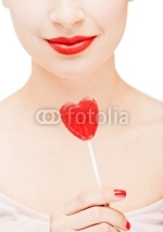 Naklejki Girl holding a lollipop