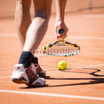 Naklejki sportsman catchs up his tennis ball with racket