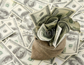 Naklejki Canvas money sack with one hundred dollar bills