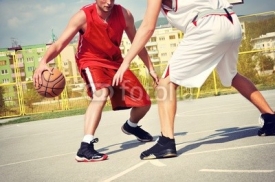 Naklejki Two basketball players on the court