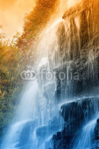 Fototapety amazing waterfall in the natural reserve at sunset