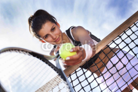 Naklejki Beautiful young girl rests on a tennis net