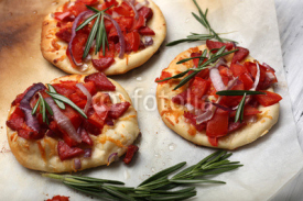 Obrazy i plakaty Small pizzas on baking paper close up