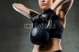Fototapety close up of woman with kettlebell in gym