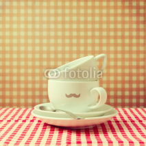 Naklejki Coffee cups with hipster  mustache on checked tablecloth