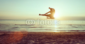 Naklejki flying kick on the beach
