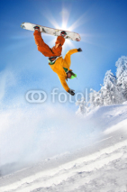 Fototapety Snowboarder jumping against blue sky