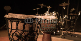 Naklejki Traditional wooden african djembe drumon stage