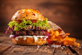 Fototapety Fresh home-made hamburger served on wood