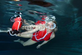 Fototapety Lifeguard with red swimsuit and diving mask 