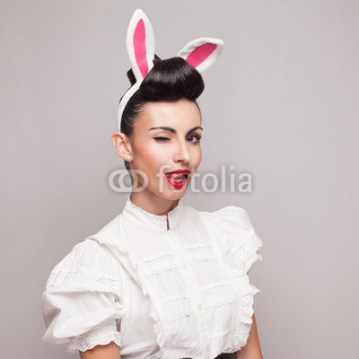 Square portrait of pretty bunny girl winking and tongue out