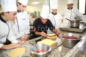 Obrazy i plakaty Students with teacher in pastry training course