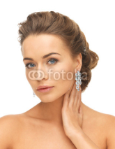 Naklejki woman wearing shiny diamond earrings