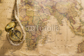 Naklejki old compass and rope on vintage map