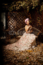Naklejki Retro woman. Girl in vintage style with flowers in hairstyle