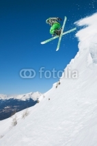 Obrazy i plakaty Jumping skier in mountains