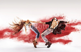 Naklejki Talented young dancers sprinkling red dust