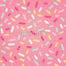 Naklejki Seamless background with pink donut glaze and many decorative sprinkles 
