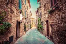 Naklejki Narrow street in an old Italian town of Pienza. Tuscany, Italy. Vintage
