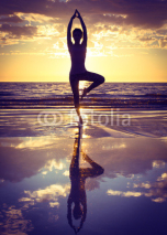 Naklejki woman practicing yoga