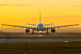 Naklejki Airplane at sunset