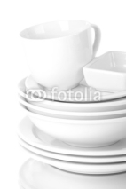 Naklejki White crockery and kitchen utensils, on light background