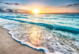 Naklejki Sunrise over beach in Cancun