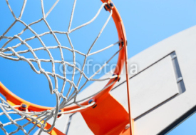 Naklejki basketball hoop on a background of blue sky