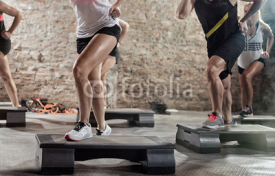 Fototapety Legs on steppers training