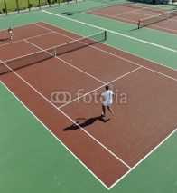 Fototapety happy young couple play tennis game outdoor