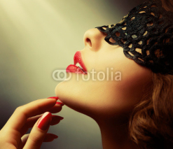 Naklejki Beautiful Woman with Black Lace mask over her Eyes