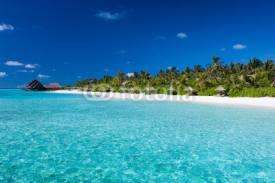 Naklejki Tropical island with sandy beach and pristine water