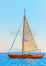 Naklejki Classic wooden racing sailing boat in Spetses island in Greece