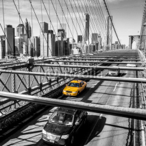 Naklejki Taxi cab crossing the Brooklyn Bridge in New York