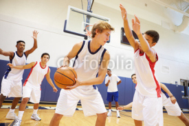 Obrazy i plakaty Male High School Basketball Team Playing Game