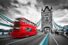 Naklejki Red bus in motion on Tower Bridge in London, the UK