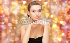 Naklejki beautiful woman with diamond ring and earrings