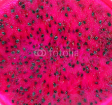 Naklejki Close up view of red dragon fruit slice