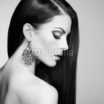 Obrazy i plakaty Portrait of beautiful brunette woman with earring