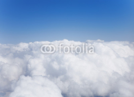 Naklejki Fluffy white cumulus clouds against the sky