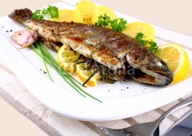 Naklejki Grilled whole trout with potato, lemon and garlic