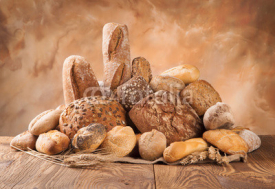 Naklejki Fresh bread on wood
