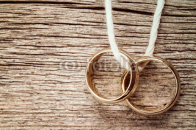 Naklejki Two rings hanging on rope