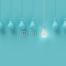 Obrazy i plakaty Hanging light bulbs with glowing one different idea on light blue background , Minimal concept idea , flat lay , top