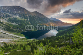 Naklejki romantic sunrise in mountains with natural pond