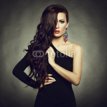 Naklejki Portrait of beautiful brunette woman in black dress